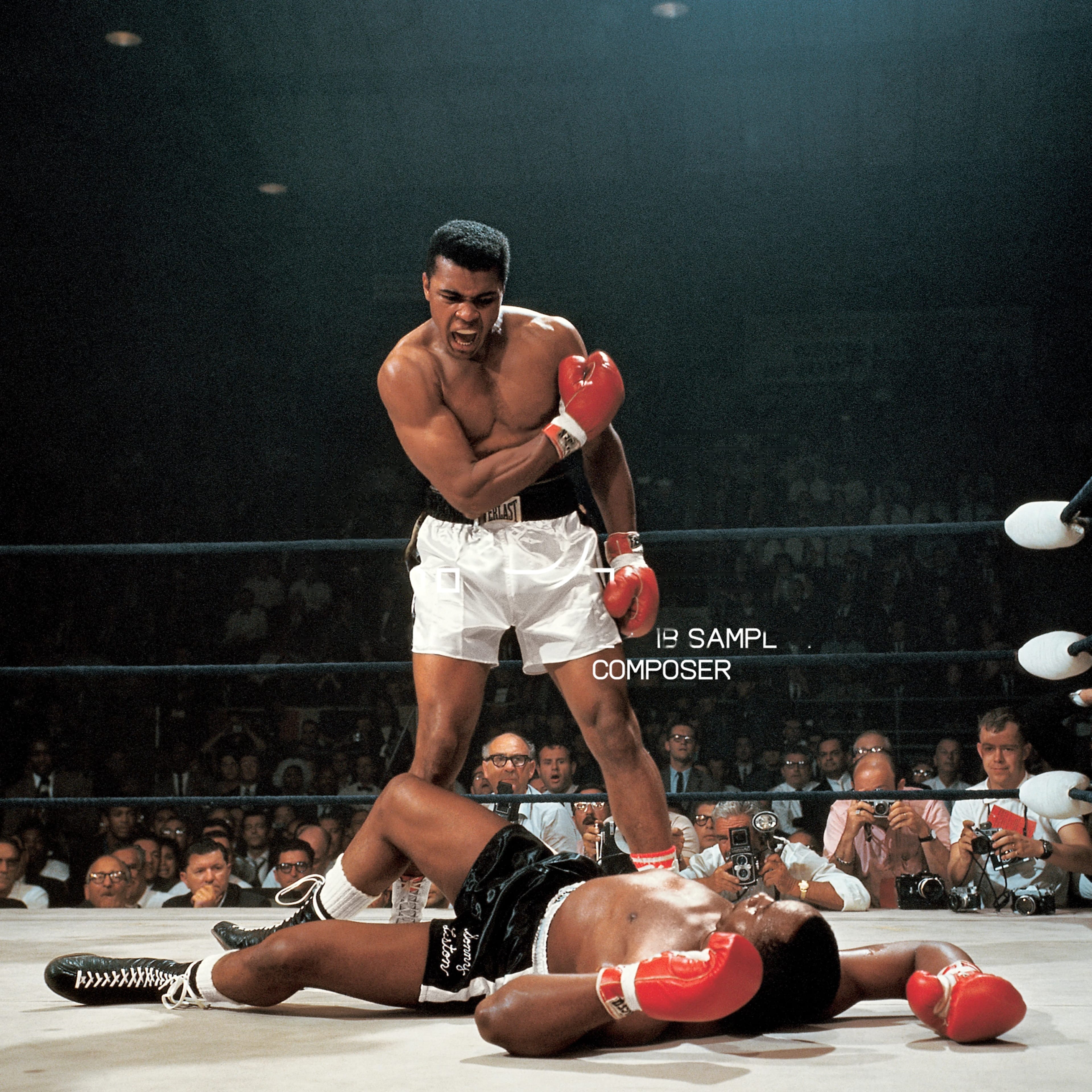 Muhammad Ali standing victorious in the ring